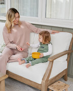 Mom with Daughter sitting outdoor on Patio
